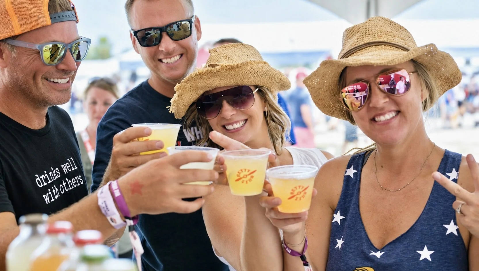 Sunlit event gathering, yellow drinks.jpeg
