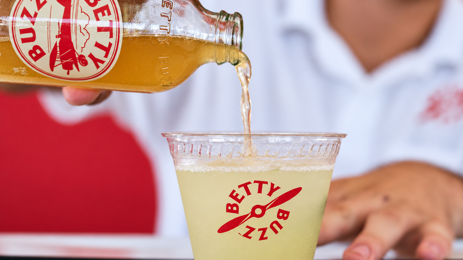 Betty+Buzz+bottle+pour+in+soft+light.png