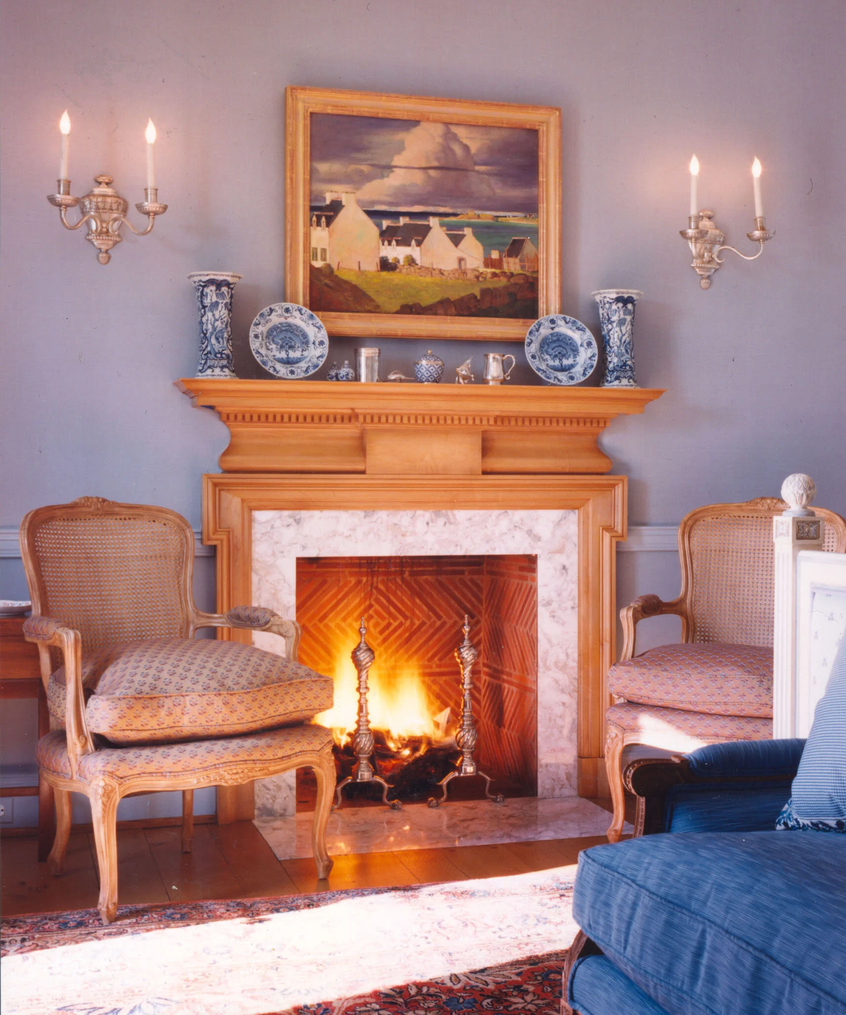 Shingle style home in Greenwich CT, stone fireplace surround