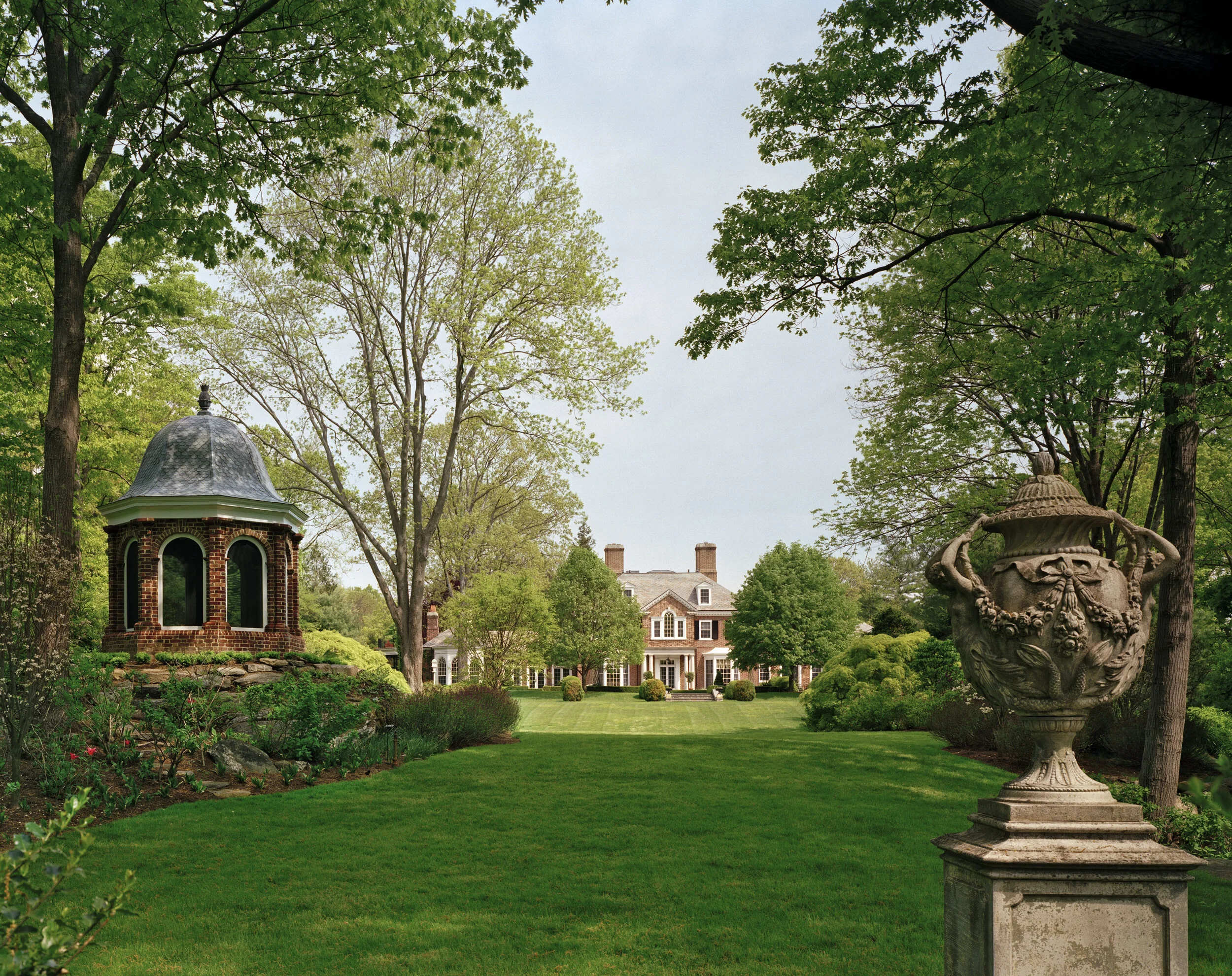 Shingle style home in Greenwich CT, outdoor fire pit area