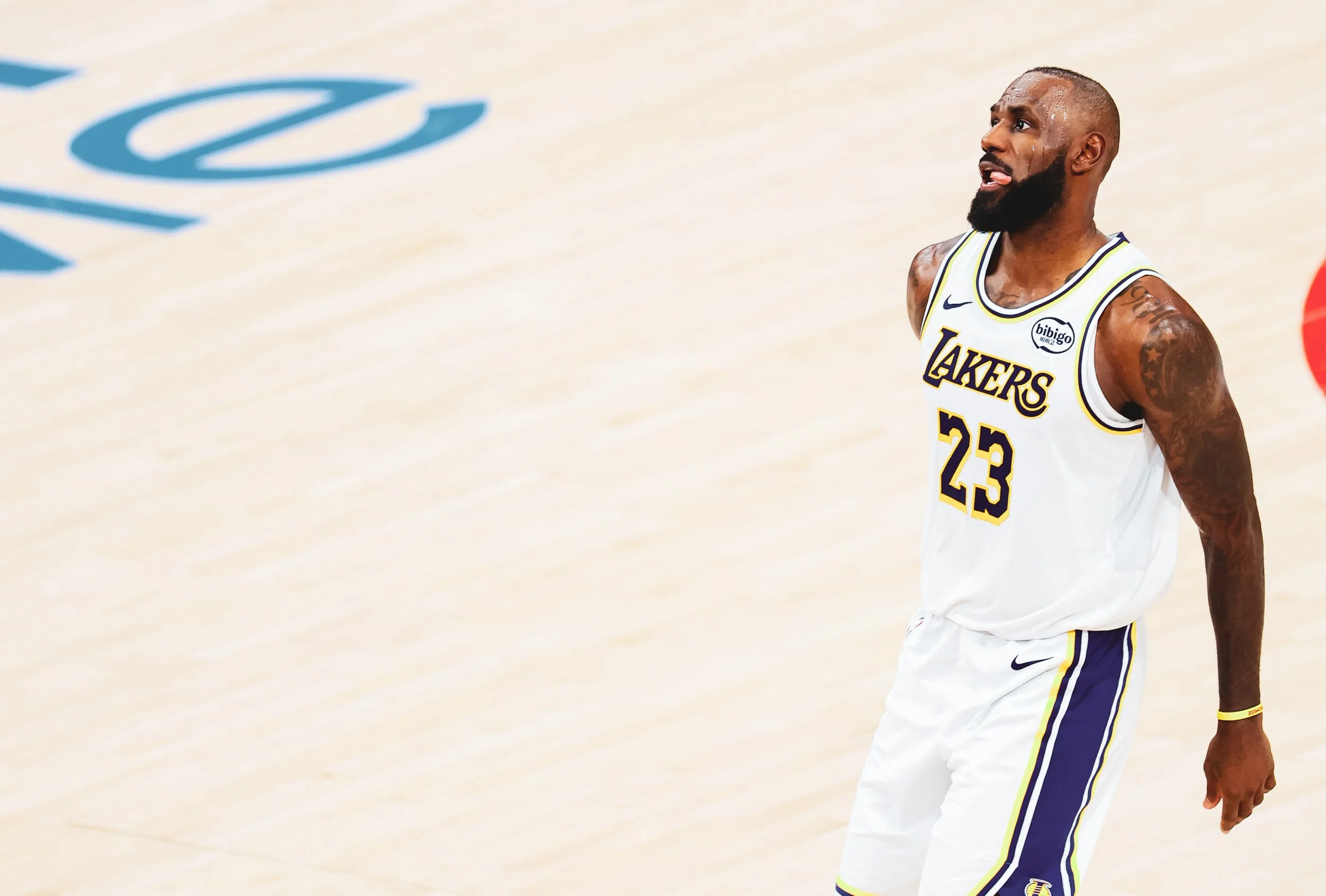 An NBA player wearing a Los Angeles Lakers jersey with the number 23 on the basketball court.