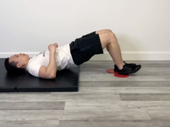 Eccentric Hamstring Slider — Rehab Hero