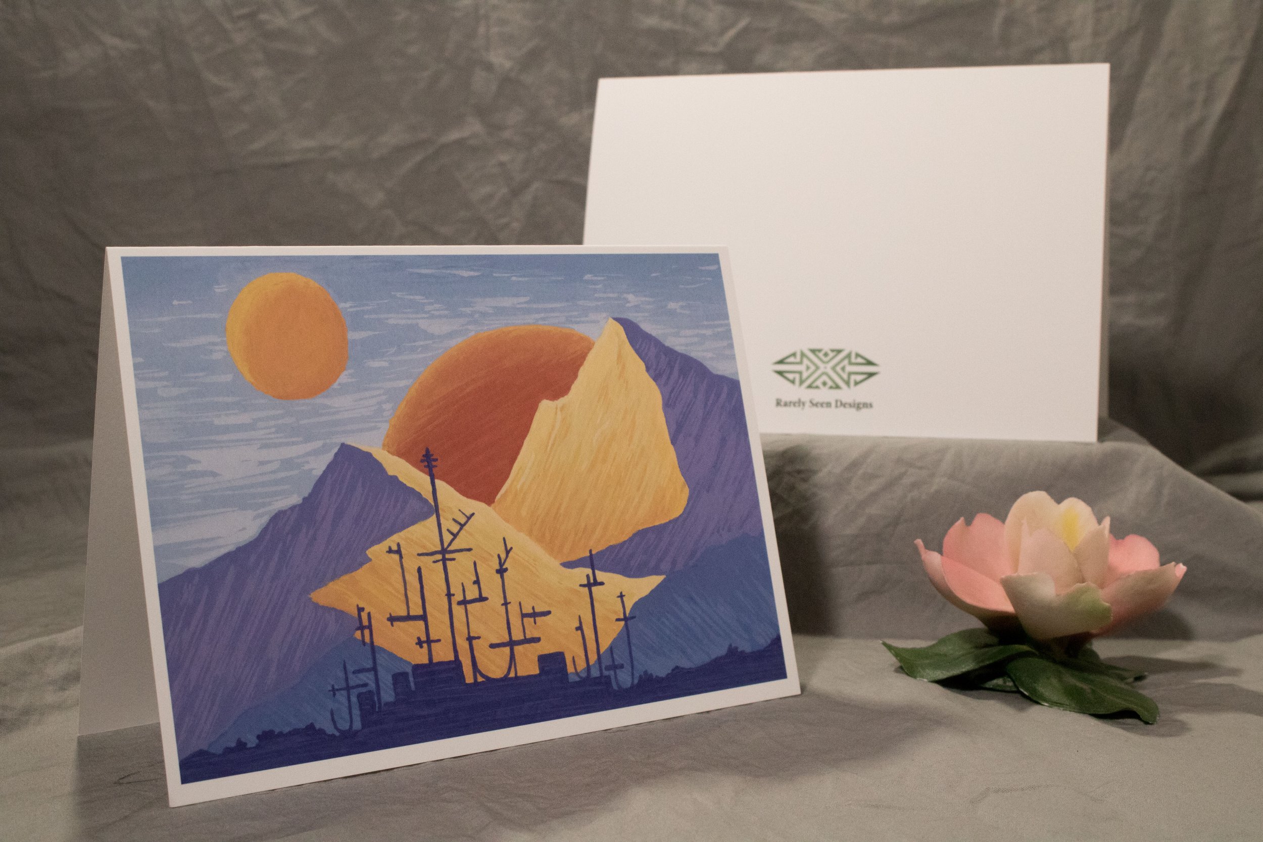 5x7 folded card depicting an industrial city under two suns