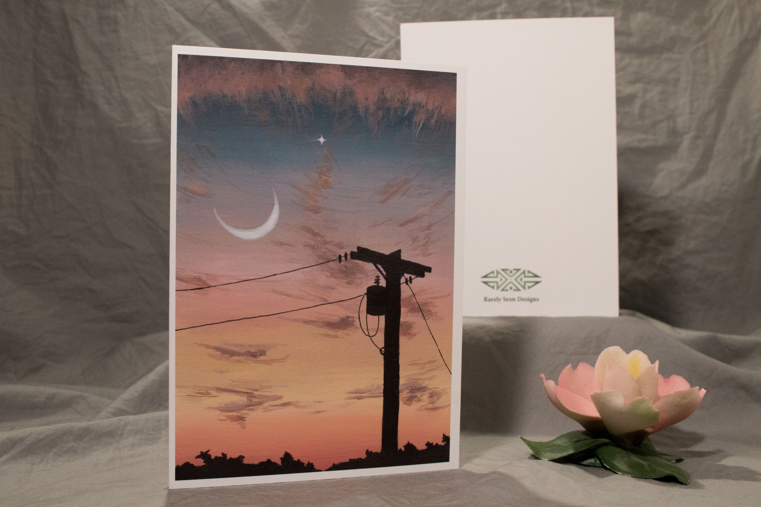 5x7 folded card depicting a silhouetted telephone pole against sunset sky