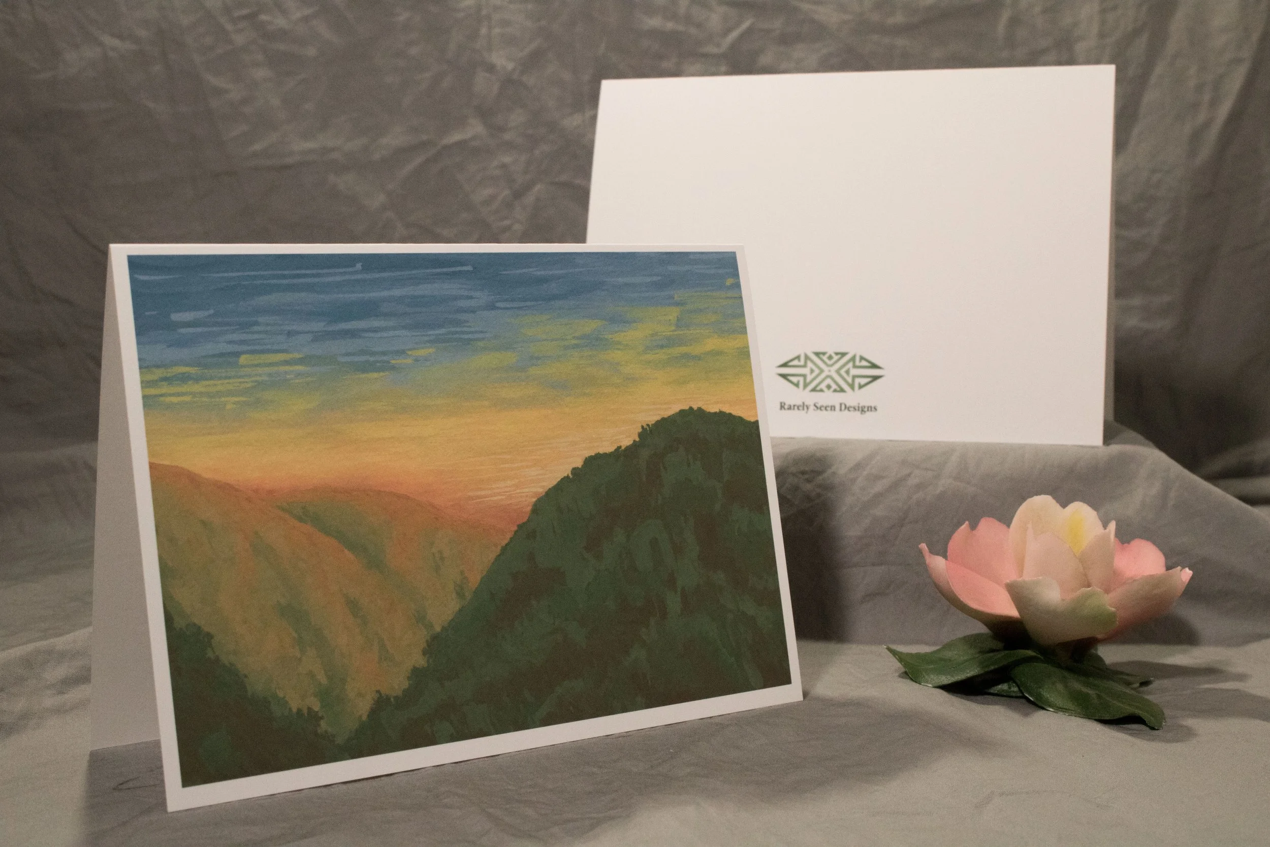 5x7 folded card depicting sunset light through a bushy canyon