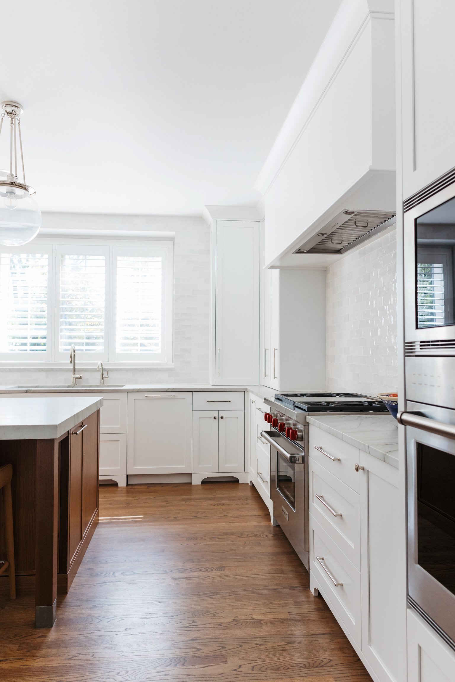 artesian-designs-kitchen-reno-chantilly-lace-walnut-island-tall-cabinet-range-alcove.jpg