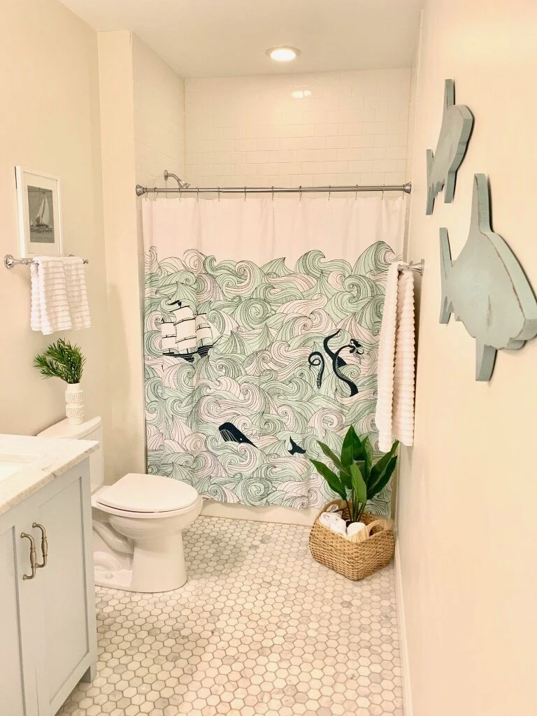 Artesian Designs Coastal bathroom SW krypton vanity light blue marble hex tile white subway alabaster