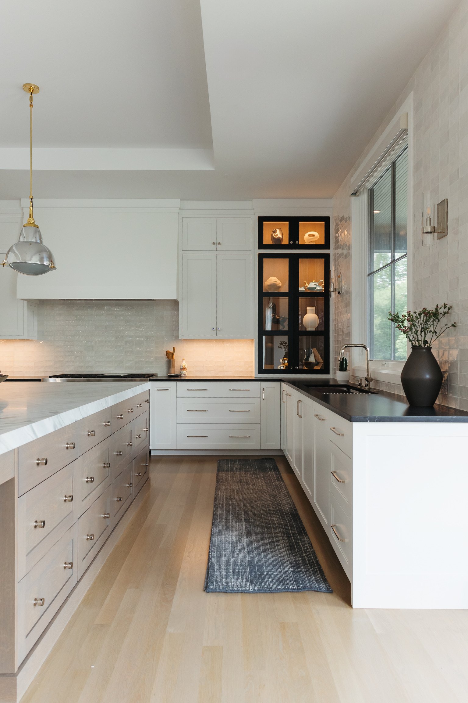 Artesian_Designs_White_Kitchen_wood_island_blackdoors.jpg