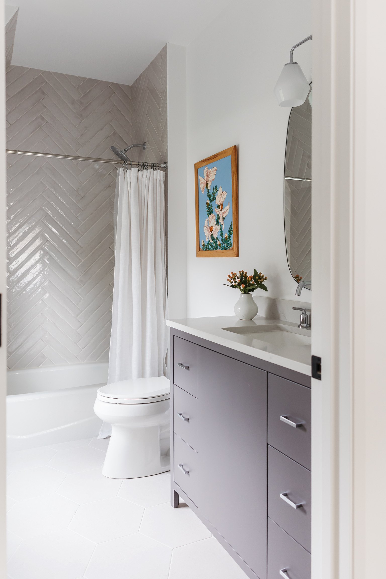 Artesian_Designs_guest_Bathroom_herringbone_shower.jpg