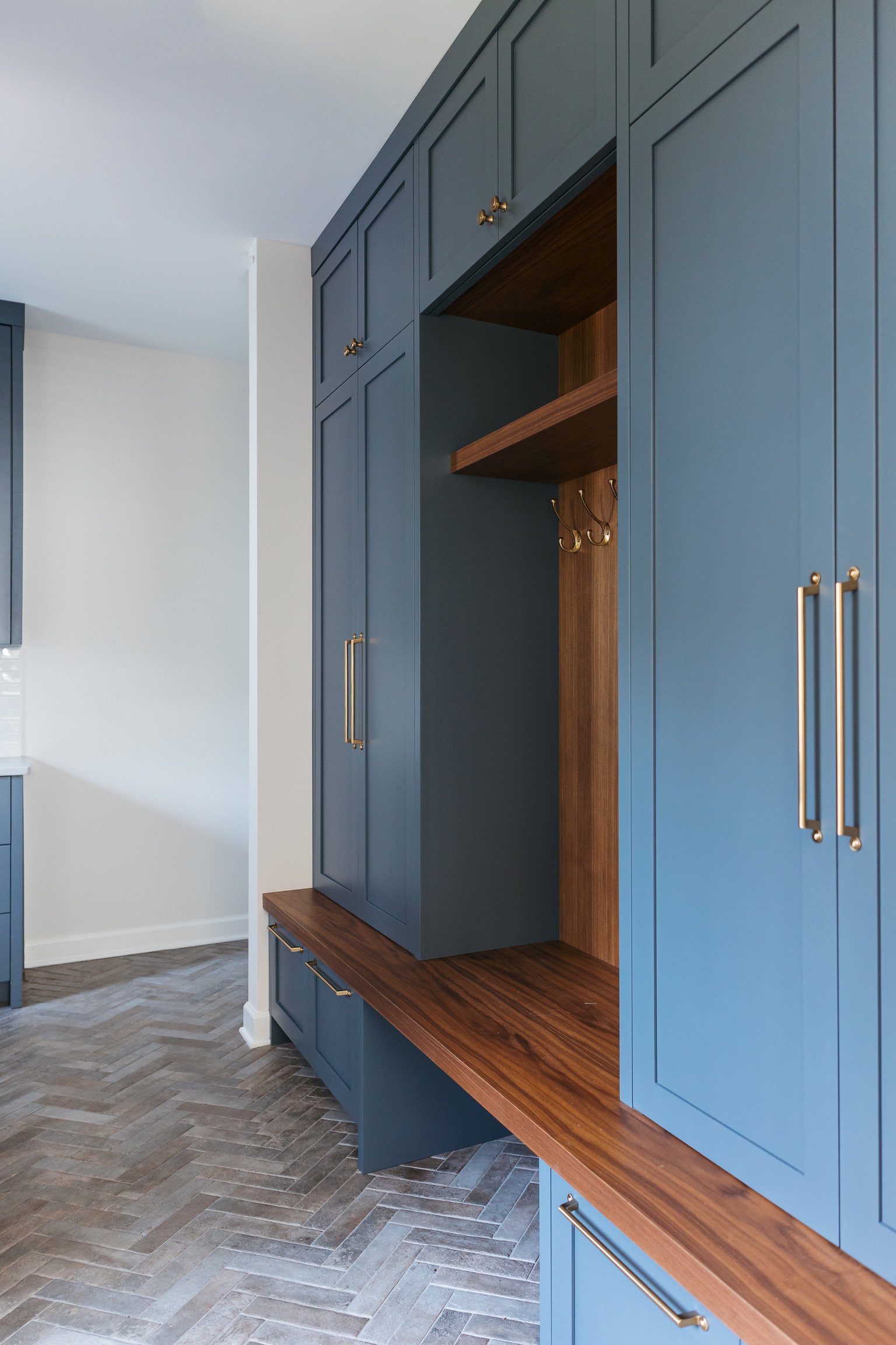 mudroom-reno-herringbone-brick-walnut-bench-ocean-floor.jpg