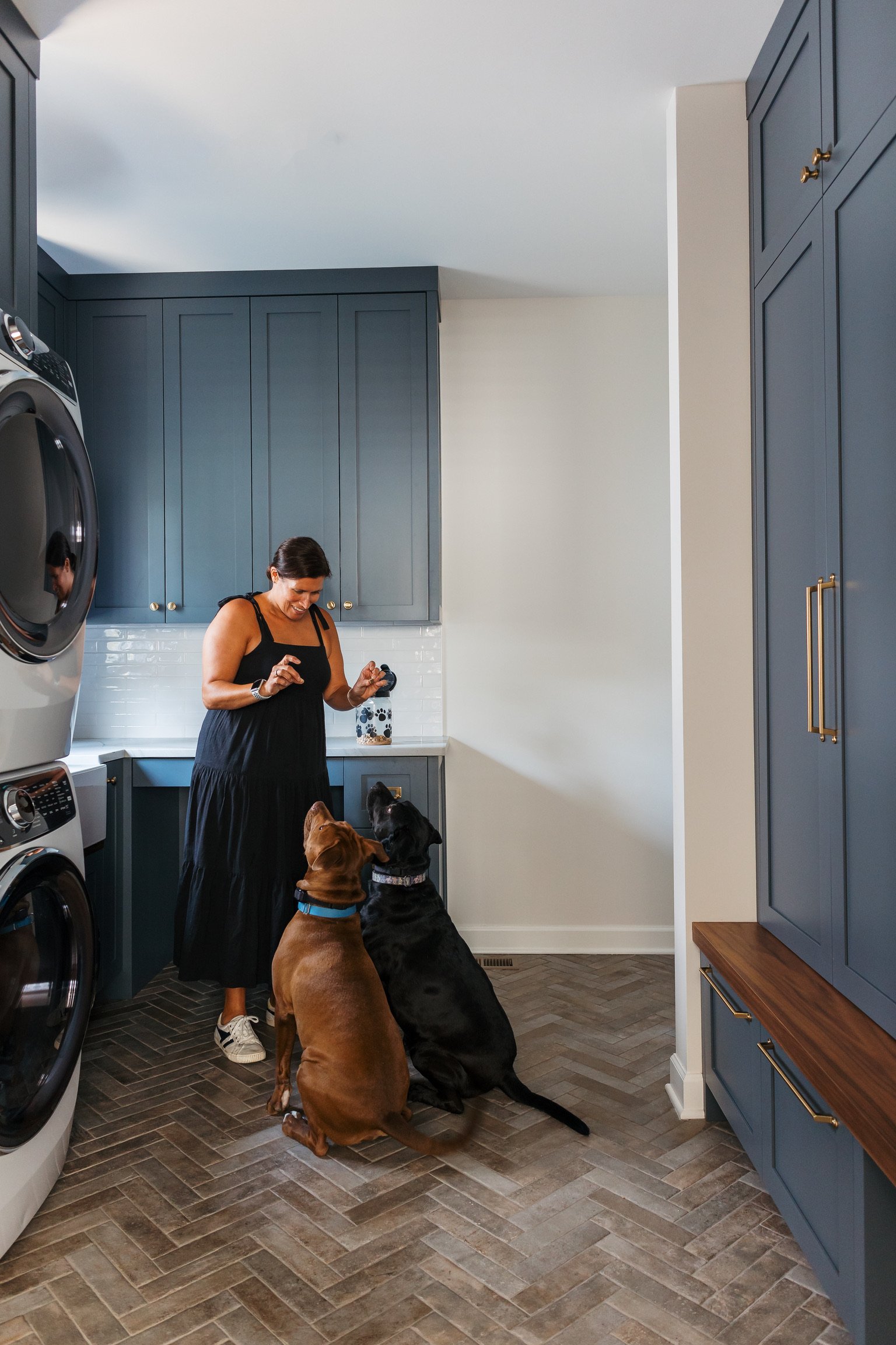 artesian-designs-mudroom-renovation-herringbone-blue-cabinets.jpg