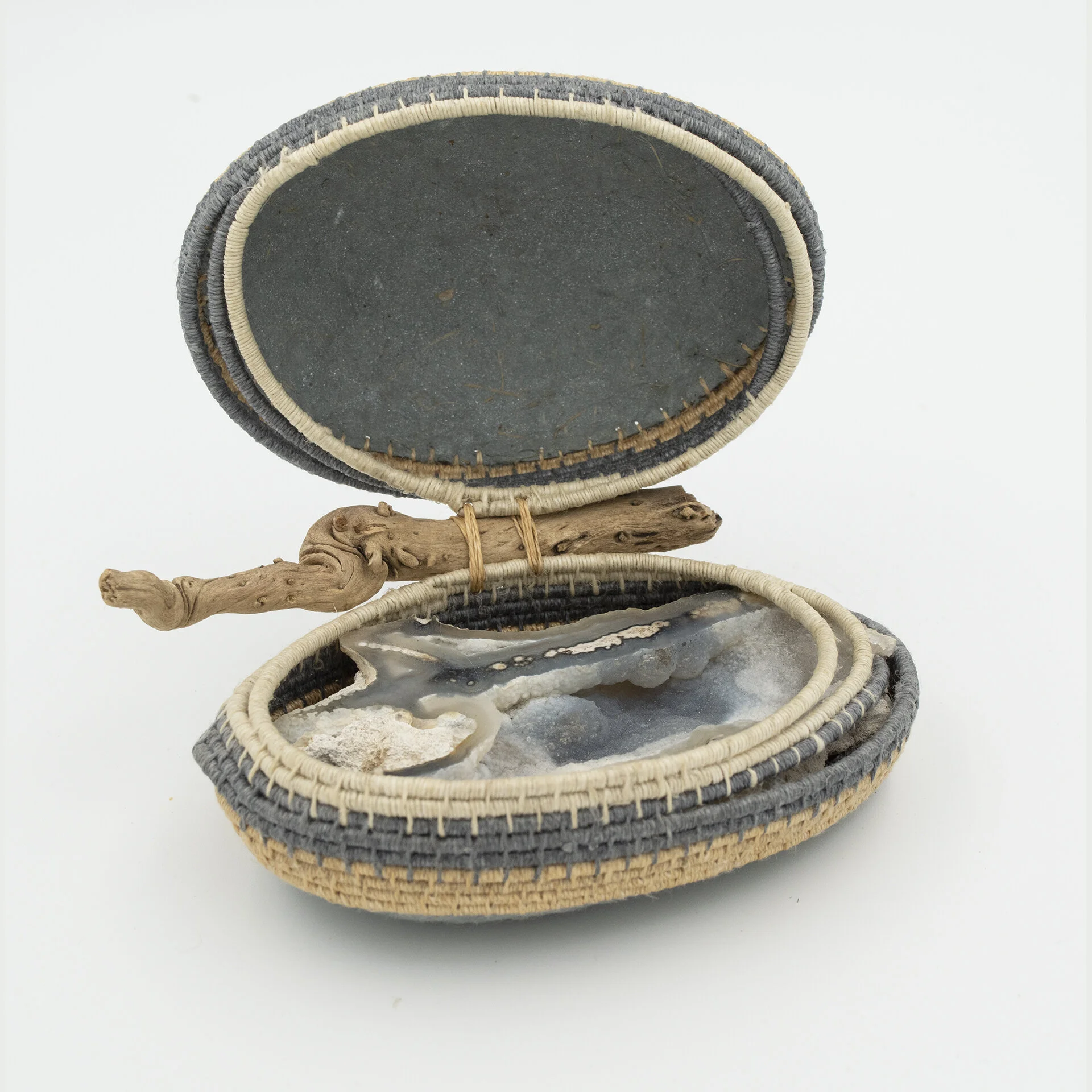 Geode. 5"x4"x3". Abaca, linen, geode, twig.