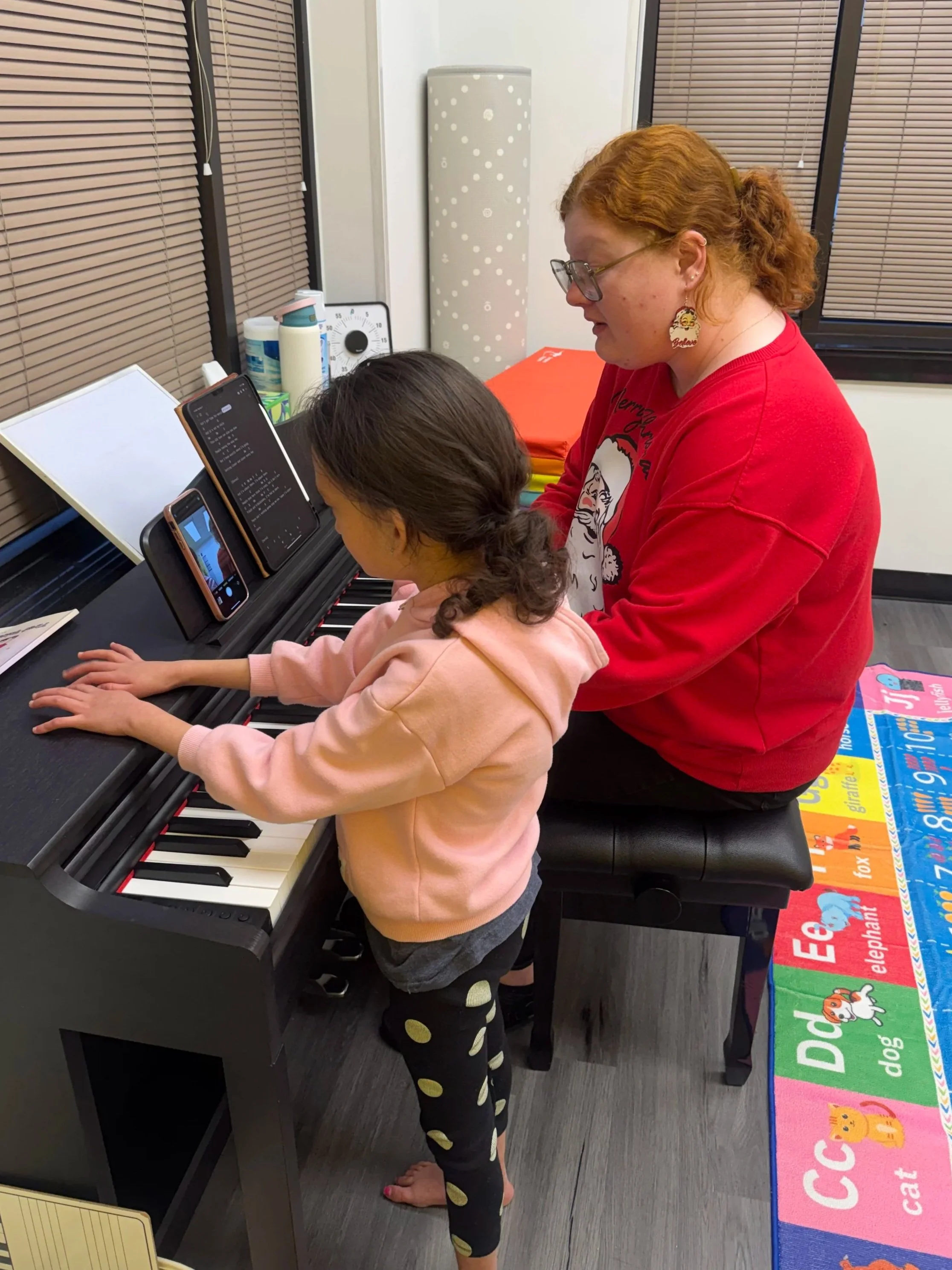Berkley standing and singing with Lydia
