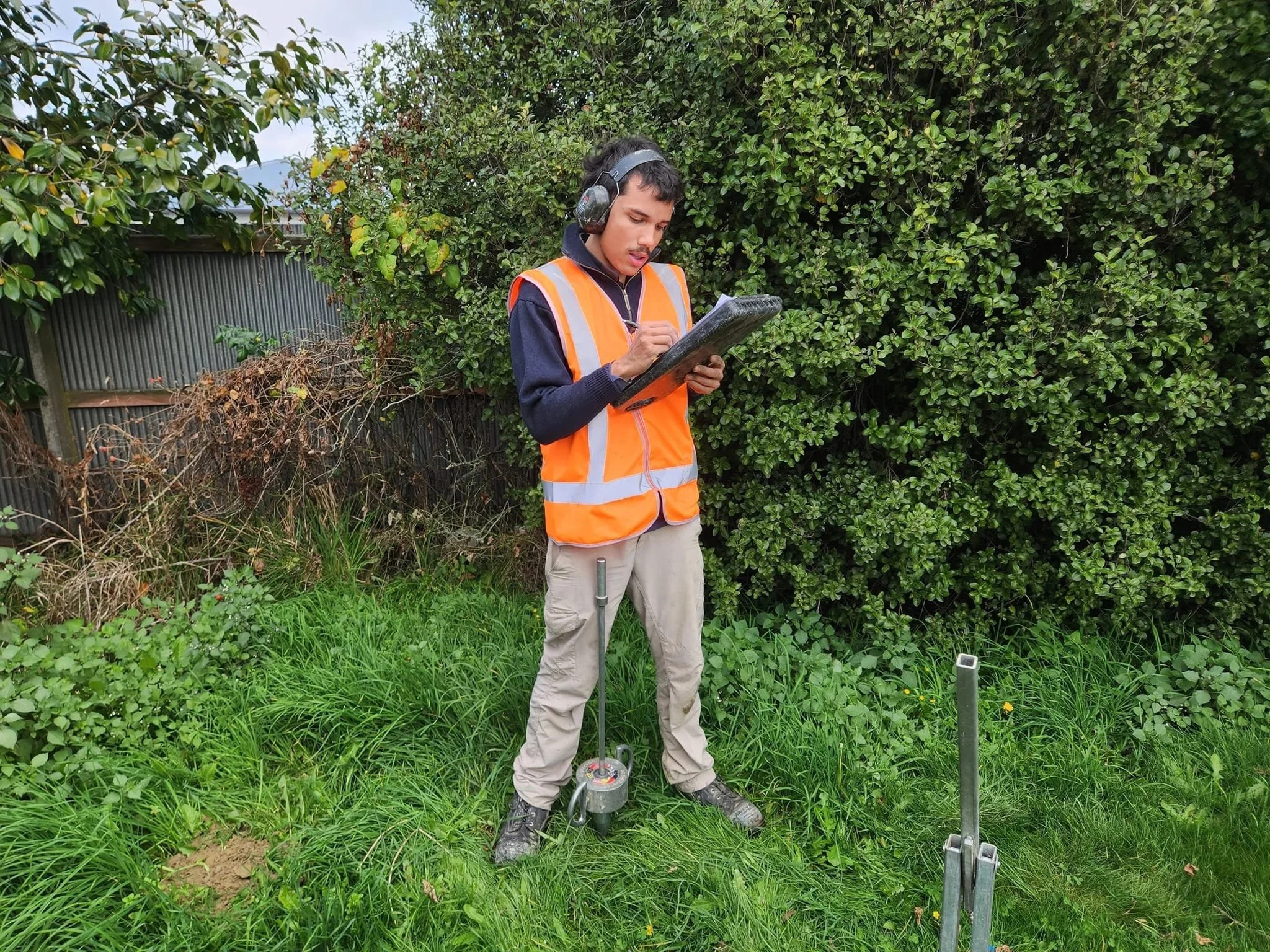 Geotechnical engineer conducting soil testing and liquefaction assessment in Kaiapoi, Canterbury.
