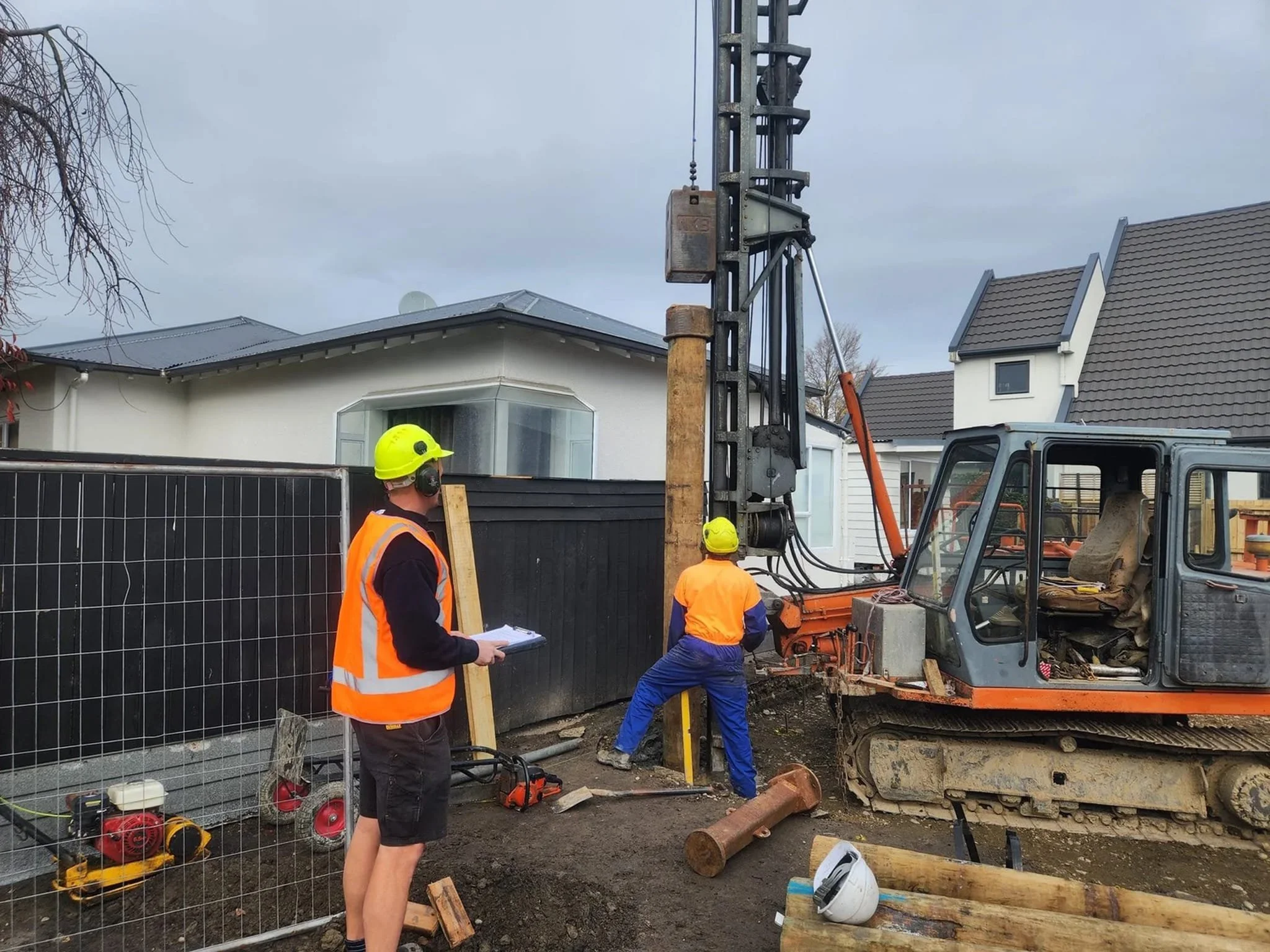 Engineering geologist supervising foundation inspection and pile installation for new build in Lincoln.