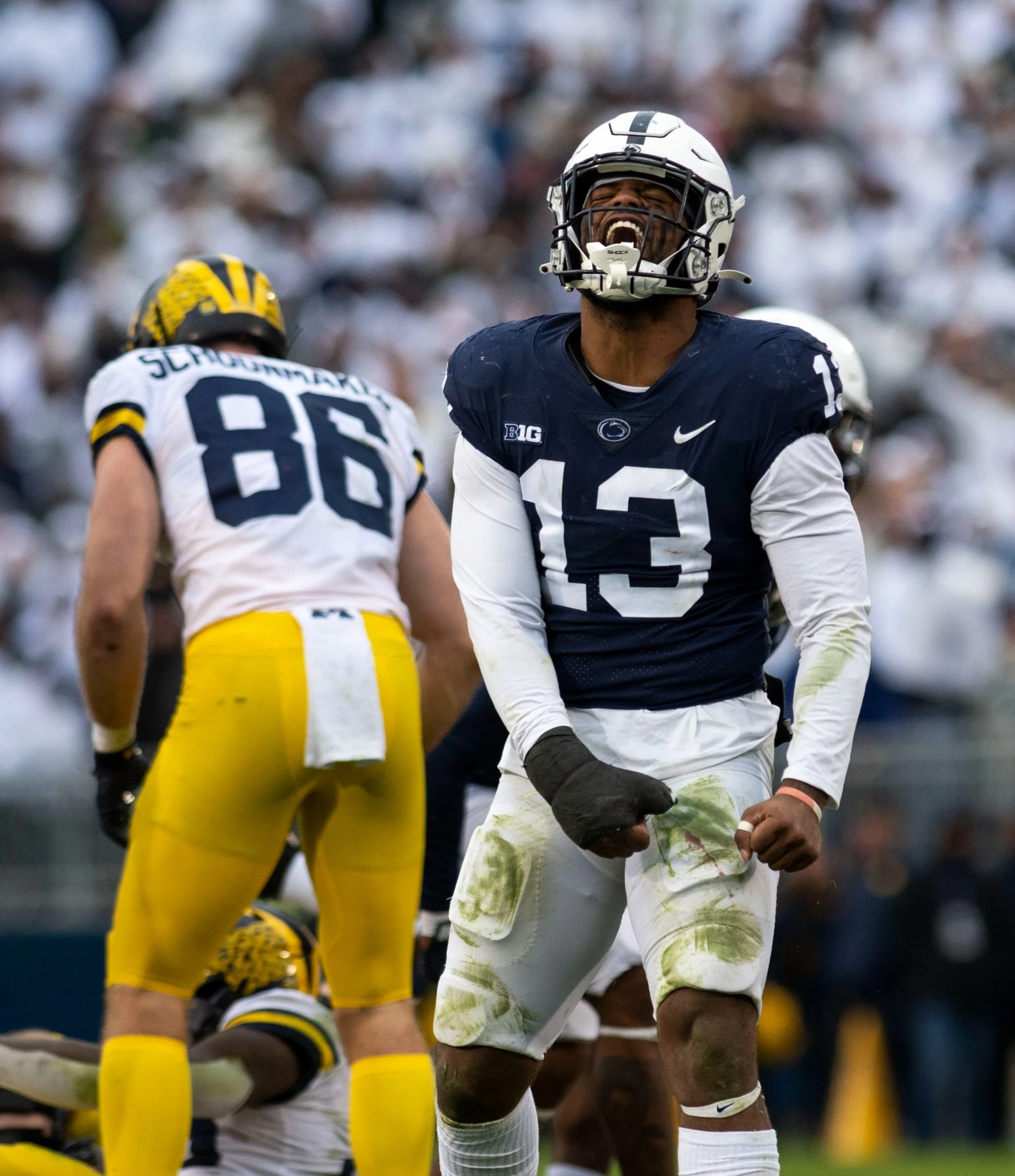 Penn State linebacker Ellis Brooks (13) celebrates a tackle during Penn State football's Helmet Stripe game against Michigan on Saturday, Nov. 13, 2021 in University Park, Pa. The Wolverines defeated the Nittany Lions 21-17.