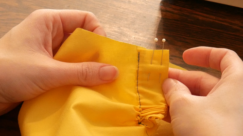Push excess fabric of the casing to the other side to make sewing easier.