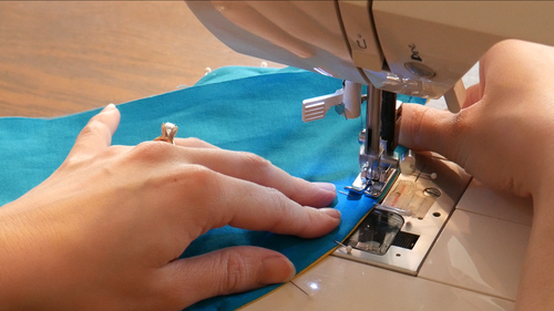 Sew the seam again at 1/4” seam allowance. Here, we use a straight stitch presser foot.