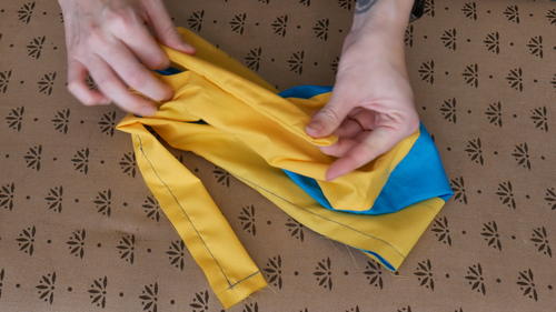 Manually turn the rest of the tie inside out.