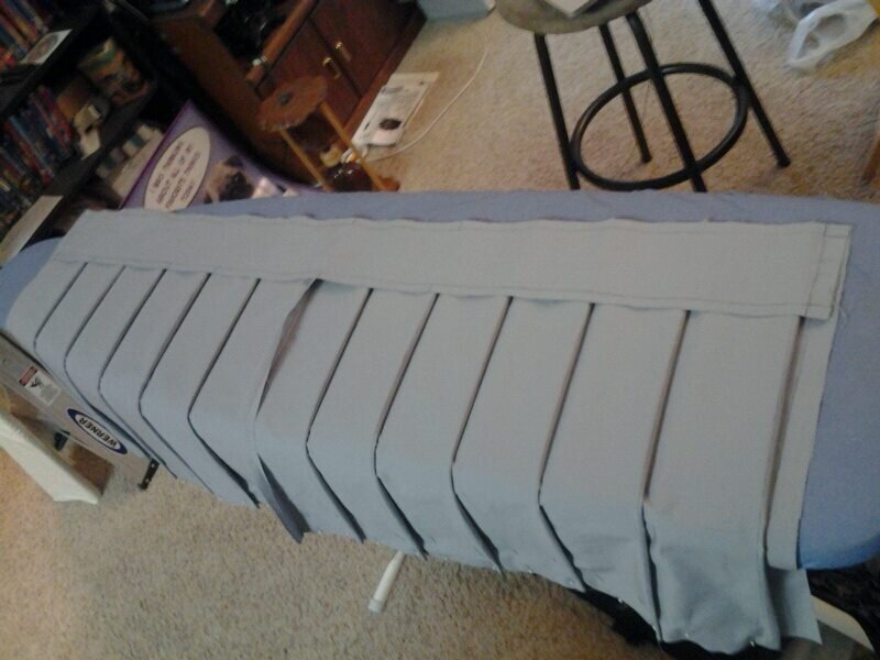 An in-progress photo of a trial run of her pleated skirt.