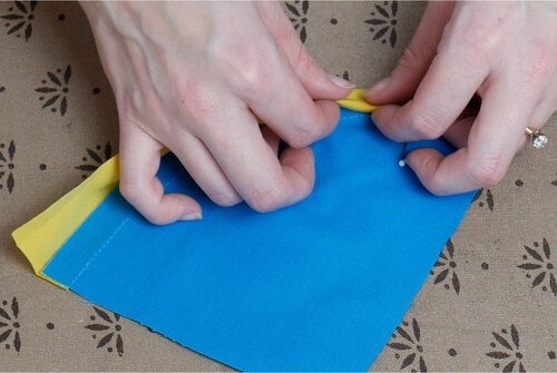 Fold the bias binding underneath itself, using the seamline as a guide.