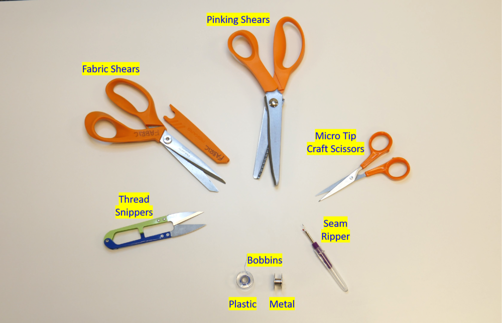 Different fabric shears, thread snippers, seam ripper, and both plastic and metal bobbins.