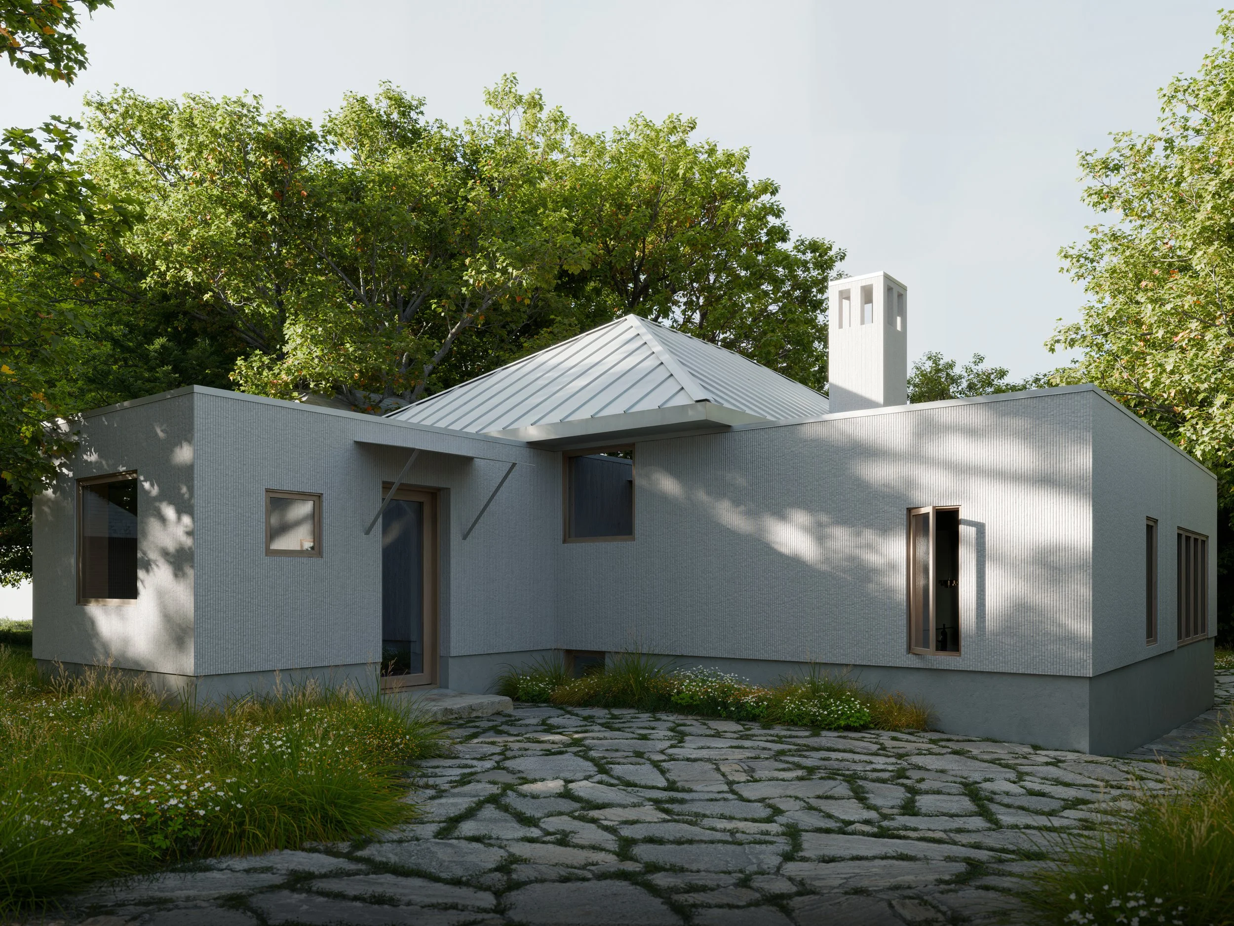 Modern house with gray exterior walls, metal roof, and large windows, surrounded by green trees and a stone pathway.