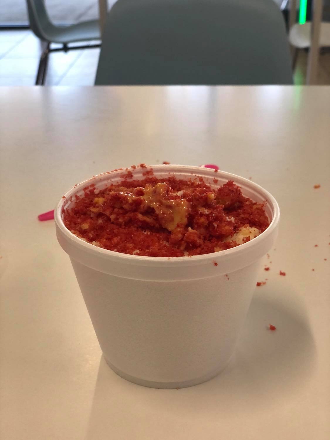 hot cheeto esquites (butter, corn, mayo, hot cheetos, cheese) at La Michoacana Azteca