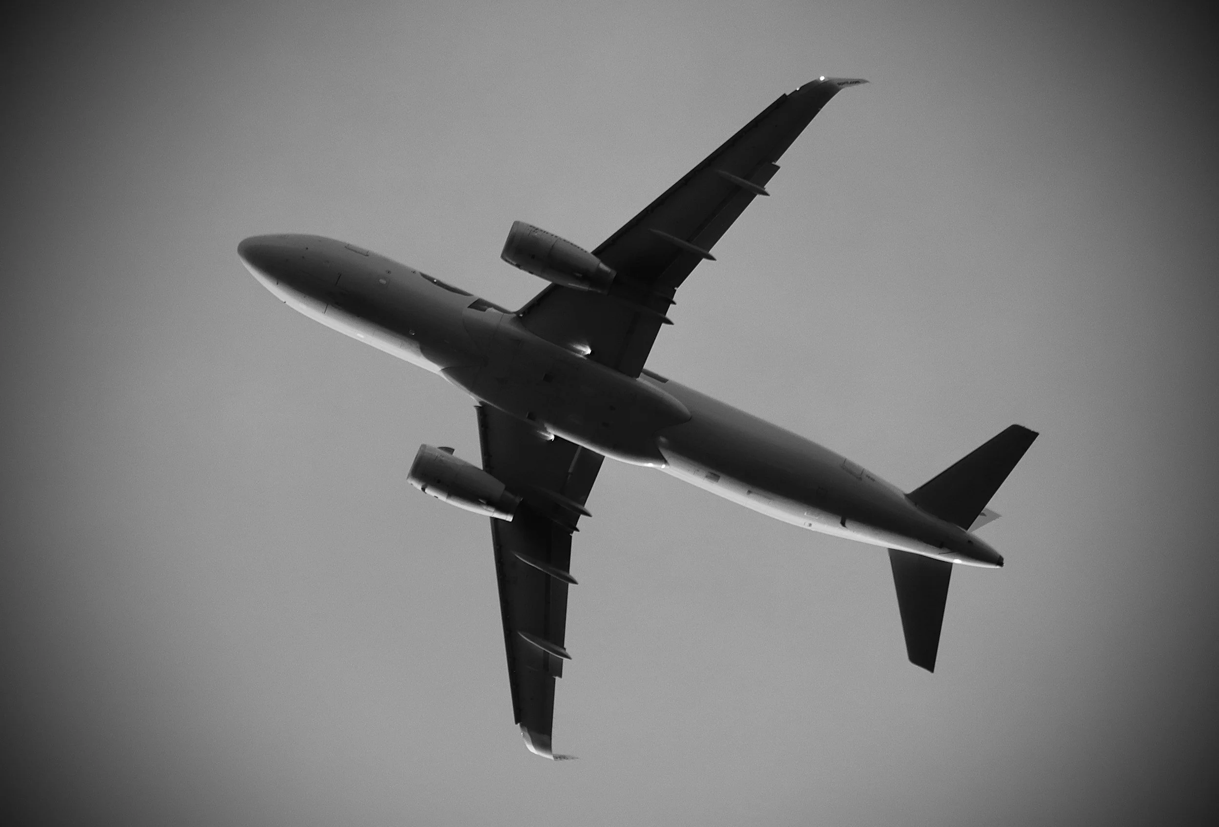 A commercial airplane flying through the sky