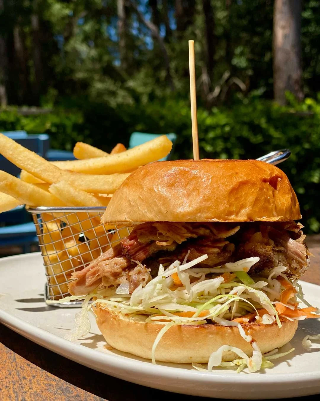 🍔 This delicious specimen is our current special - Pulled Pork Burger.

That's an 🔥18hr🔥 smoked pulled pork burger, served with an 🍎 apple cider vinegar slaw, 🥒 pickles and a tasty tangy BBQ sauce. 

‼️ Limited serves available ‼️ 

See you tomo