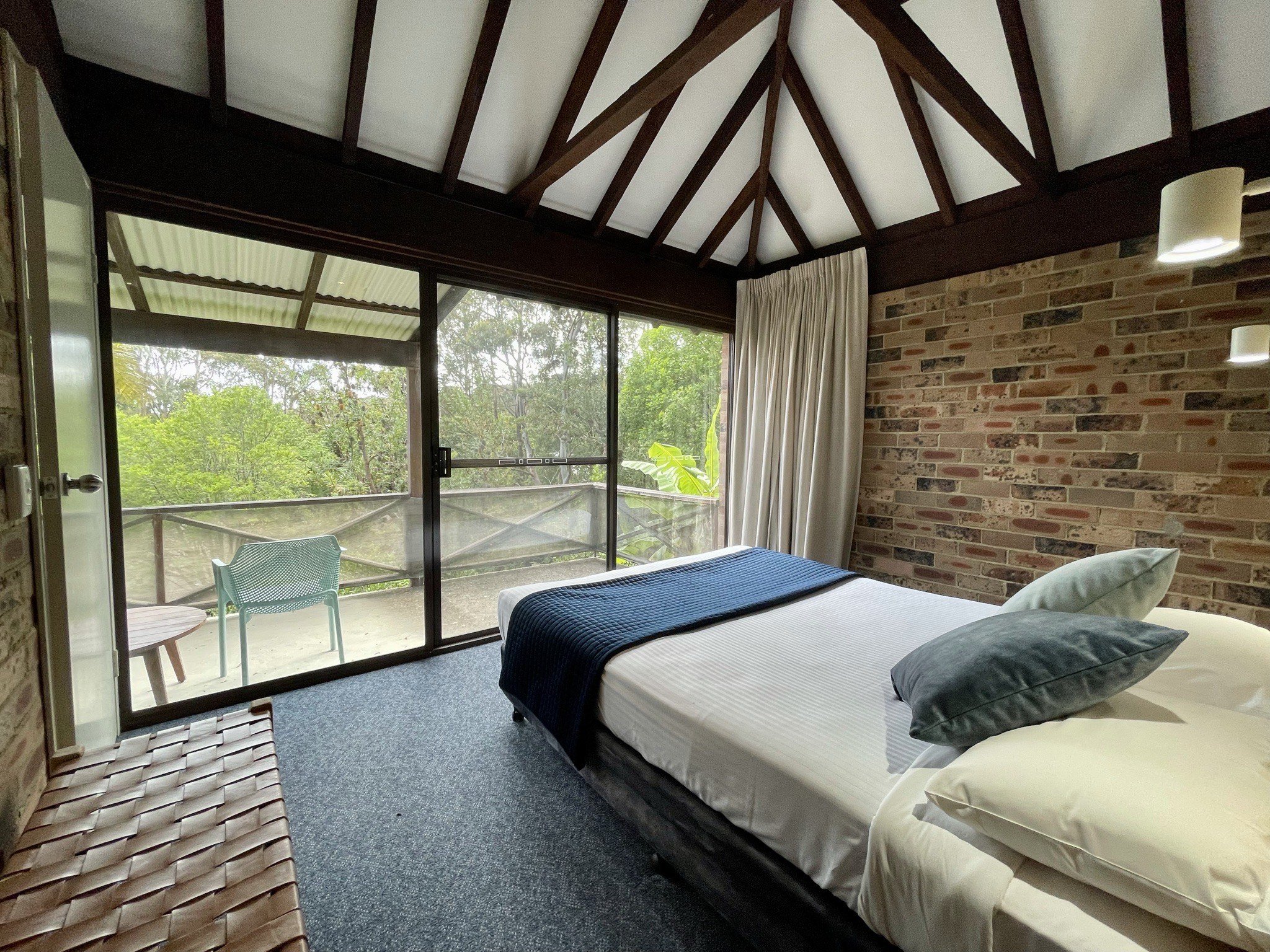 Main bedroom opens onto leafy view