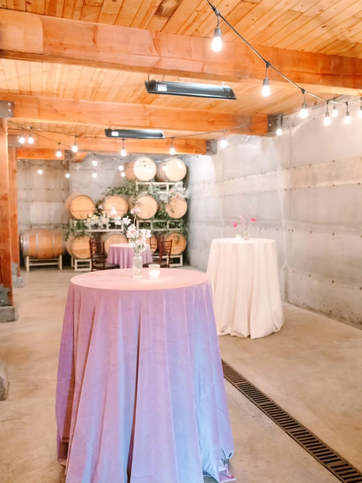 The barrel room at Chateau Lill is an area we don't often get to design for a wedding so being able to plan for this March weddings cocktail hour was a fun change.

There were flowers and greenery throughout the barrels and the tables had lush, velve