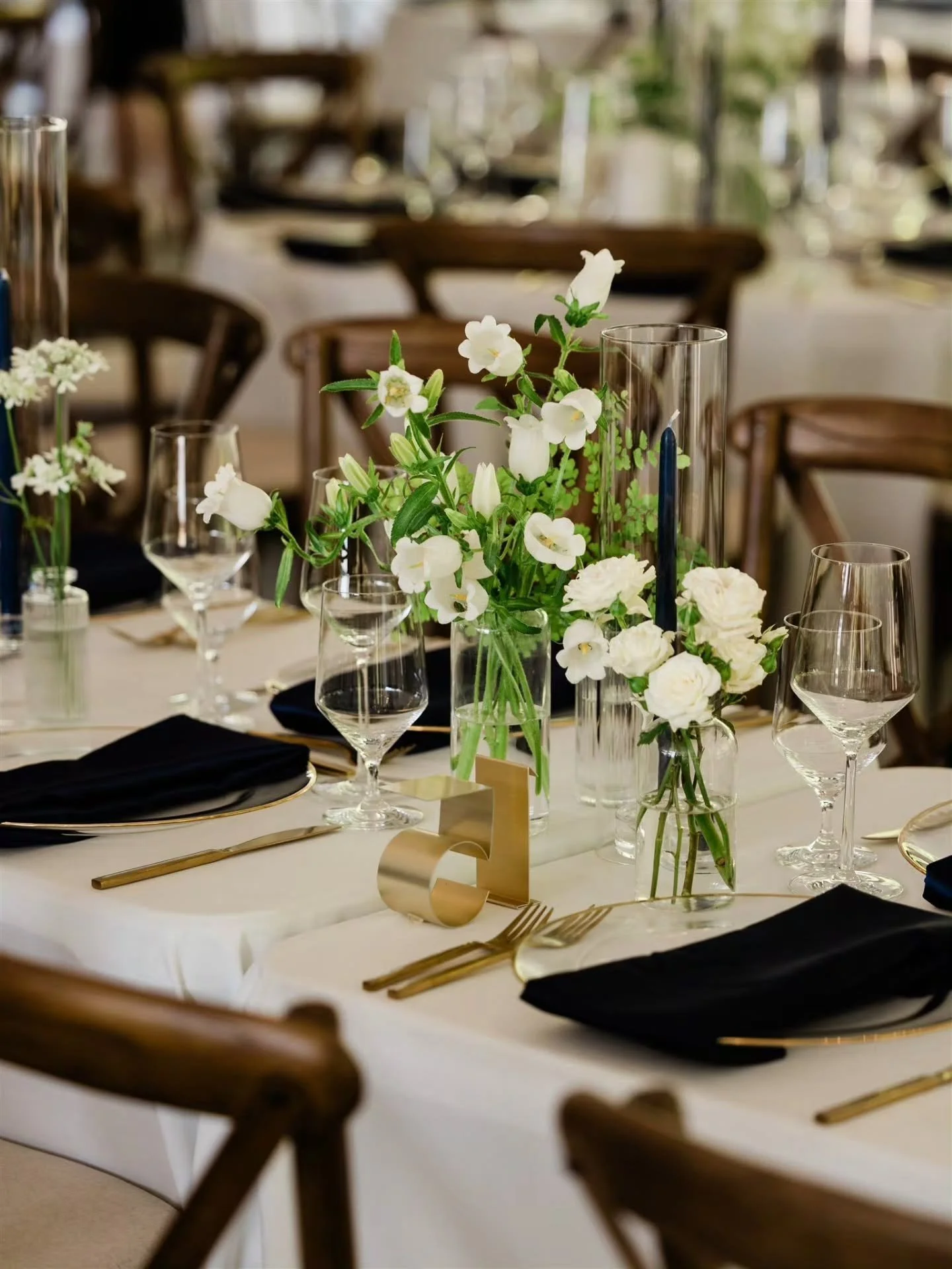 Classic navy blue and gold at Chateau Lill

Alice and Dean wanted a classic color palette to reflect Dean's family history of being around country clubs. 

This design brought a modern, NW touch to that feel, which also adds to the natural beauty aro
