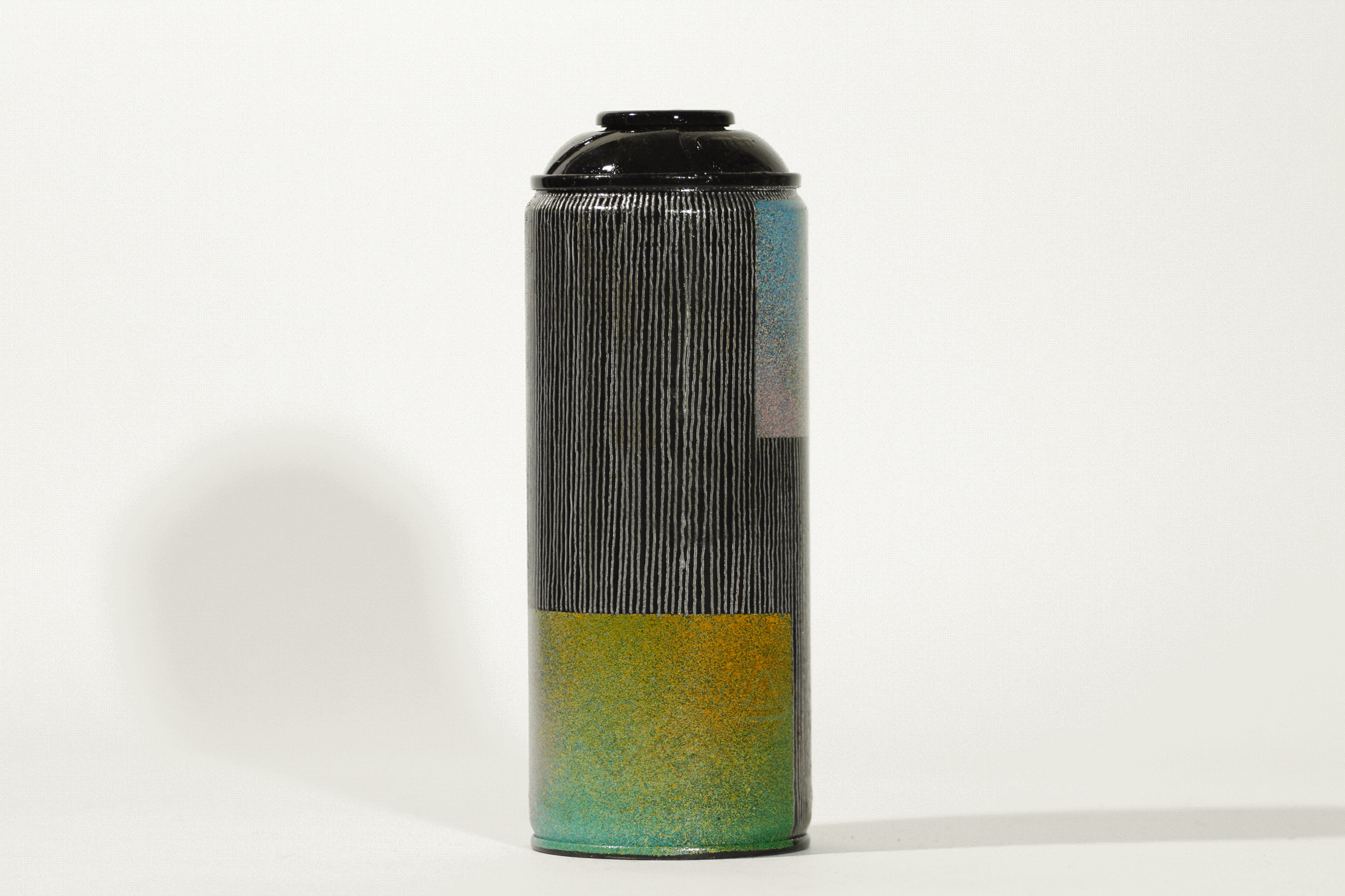 Gif of a spinning black spray can in a white studio setting