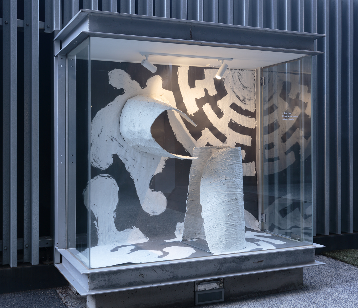 A photo of a glass vitrine containing the work Performance number 1 to 3