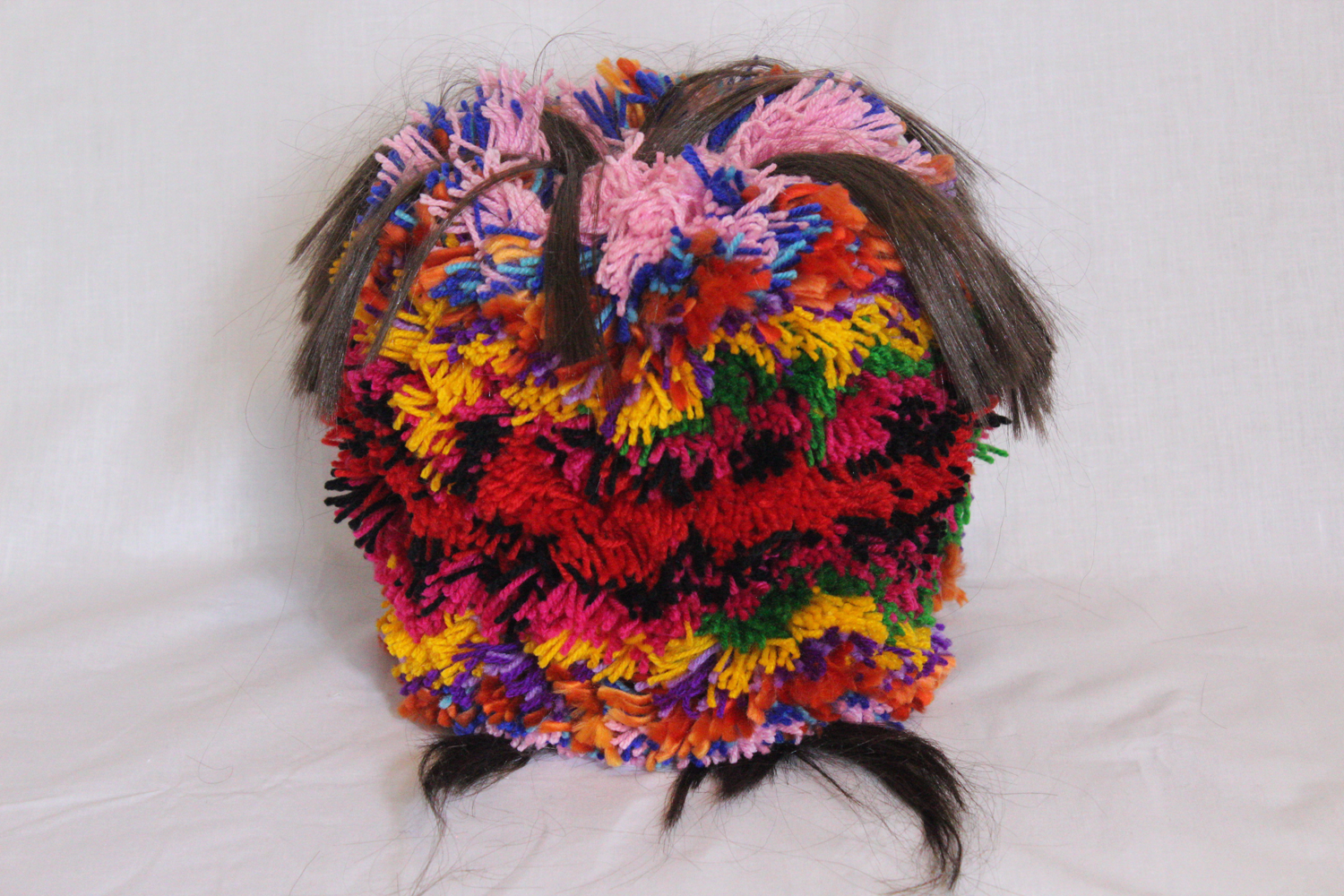 Oversized colourful woolen pom-pom with synthetic hair