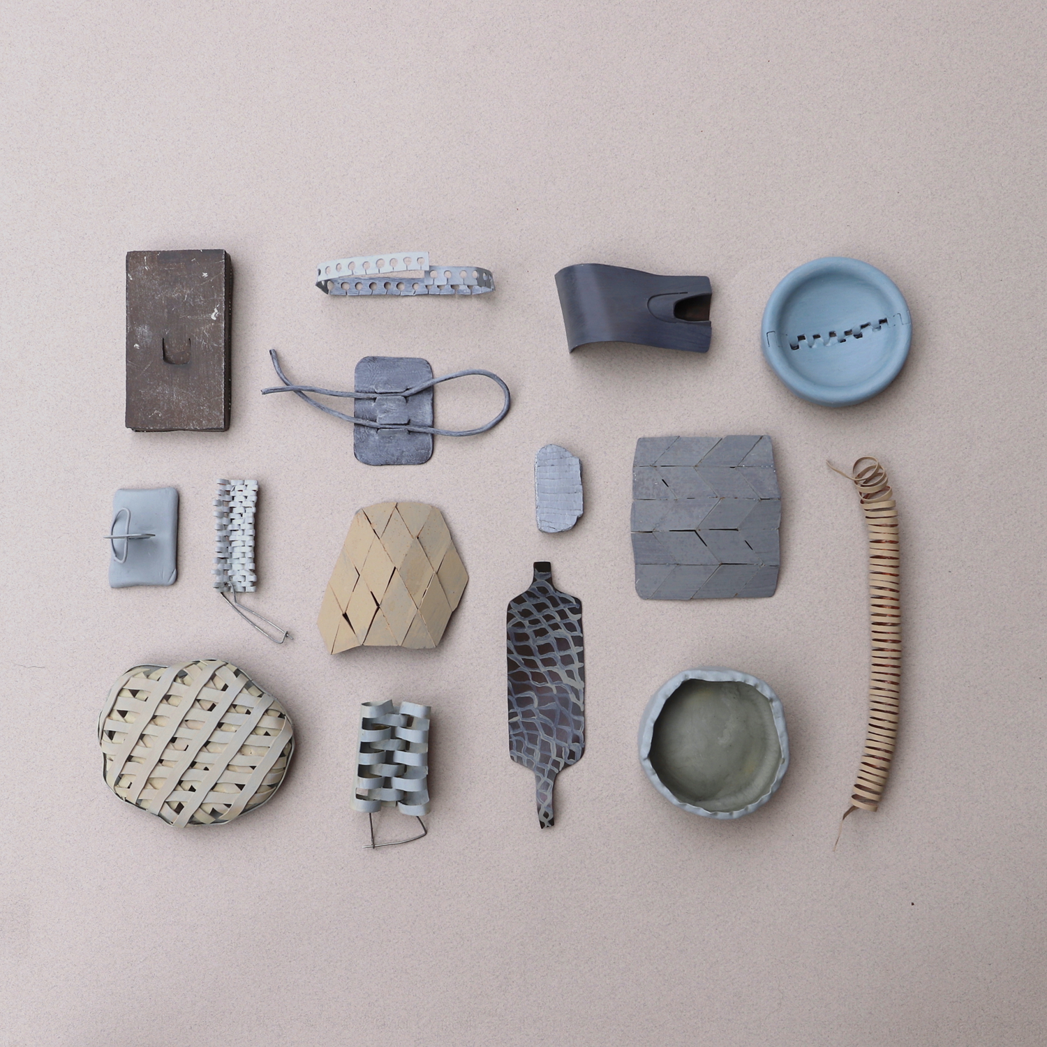 group of hand-made objects in grid or archive pastel colours 
