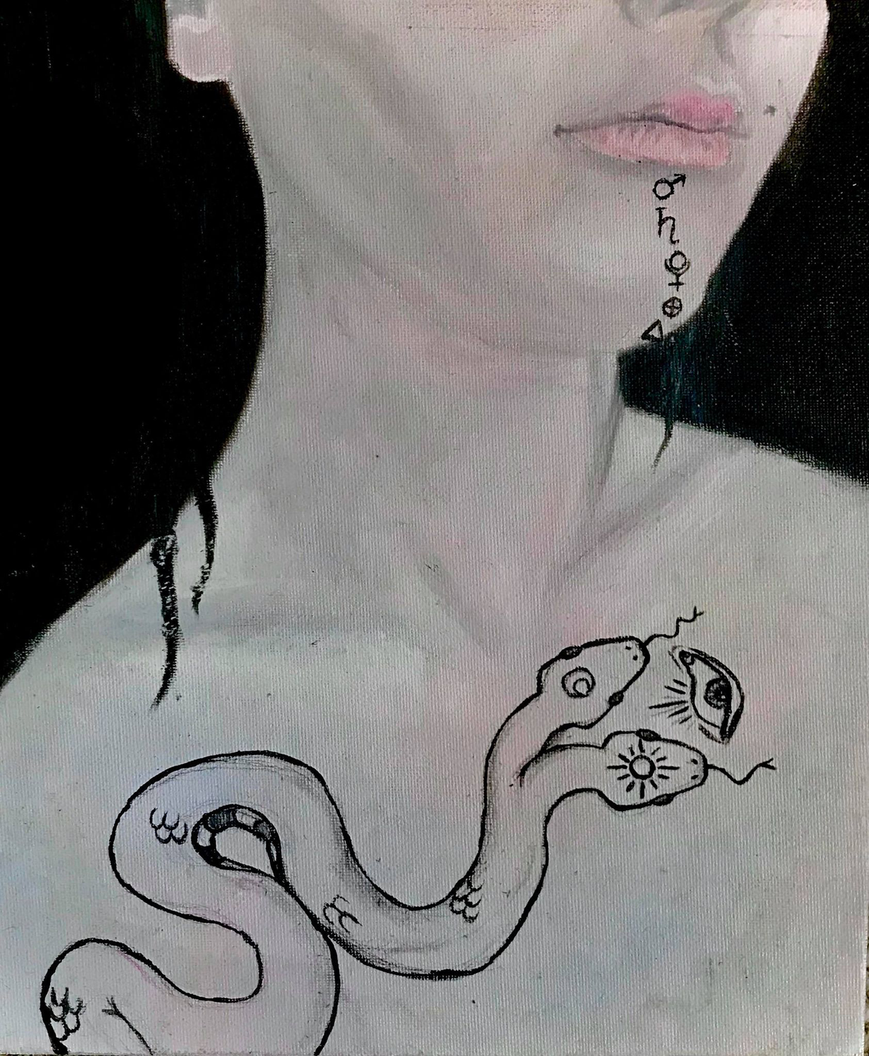 A girl painted from her nose to her chest, down her lip to chin a range of alchemy symbols.  