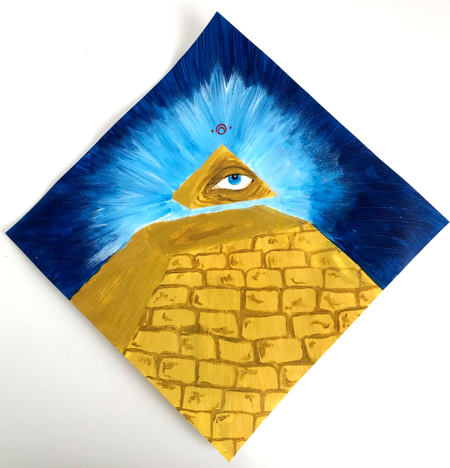 a pyramid with an eye against a blue background and an alien text above the pyramid 