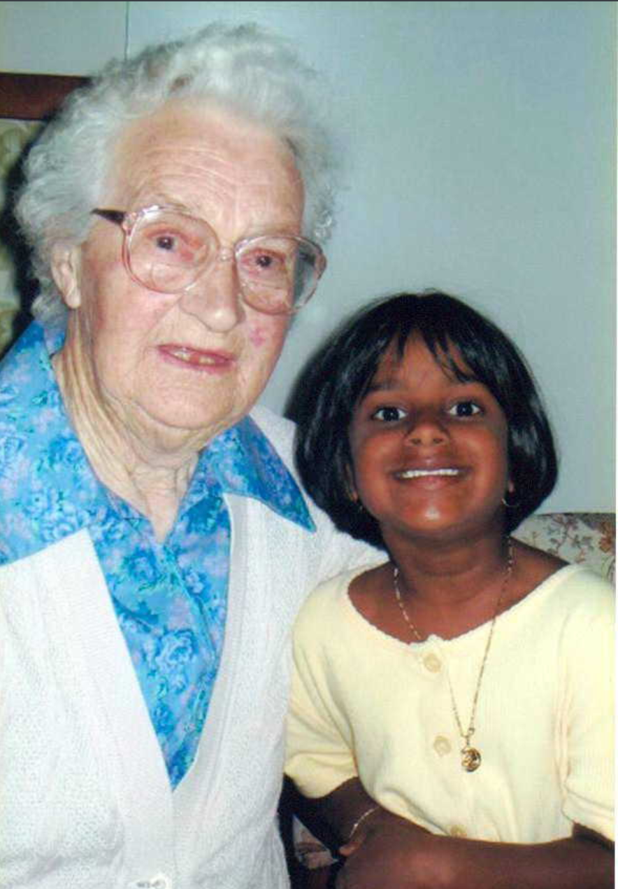 Analogue photography of elderly woman and young child.
