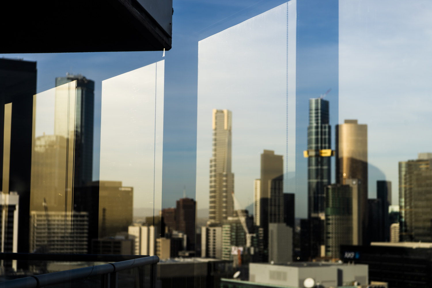 Colour photograph of a window view overlooking the cityscape.