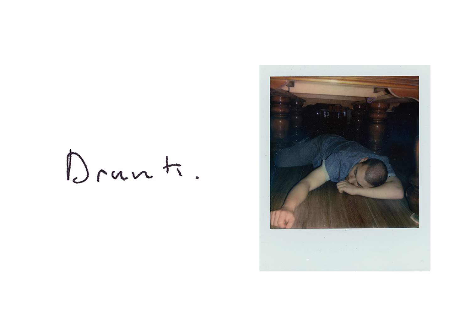 Text with Polaroid depicting man lying on floor drunk.