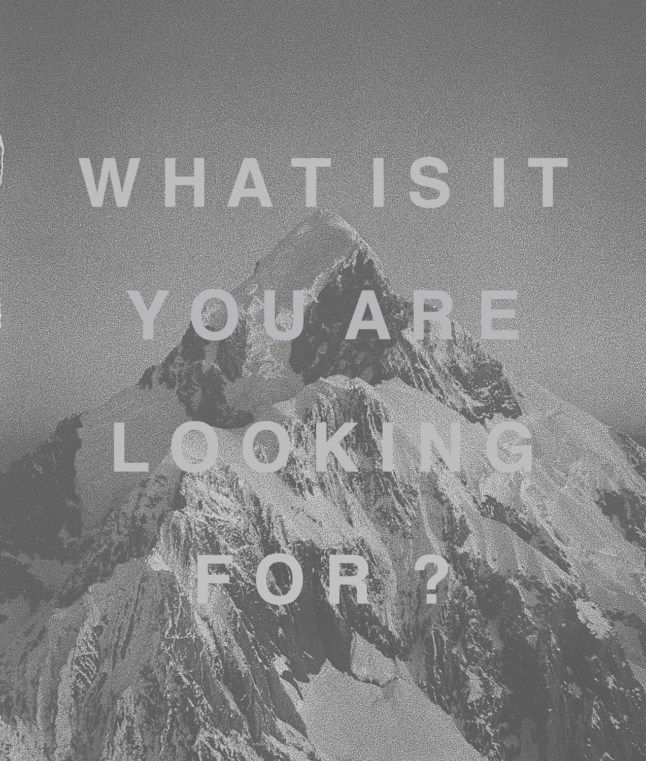 text layered on greyscale mountain top