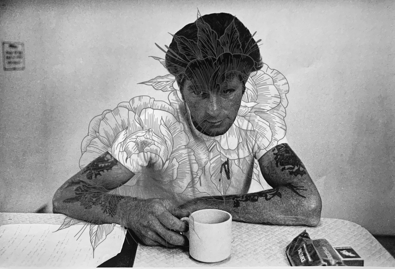 drawn flowers layered on greyscale tattooed man with coffee 