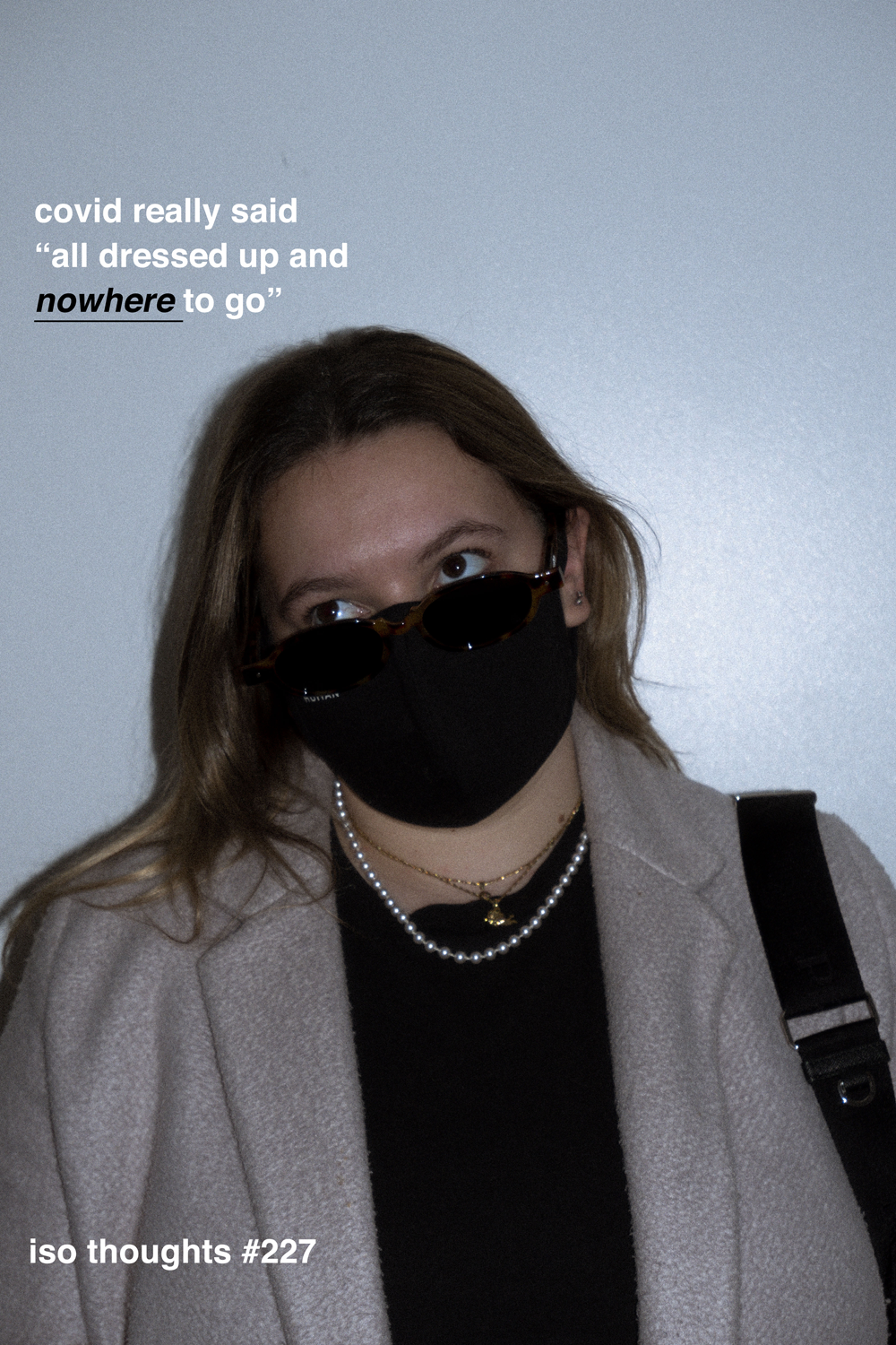 Colour photograph depicting portrait of a young woman wearing a mask and winter coat. Text overlays the image.