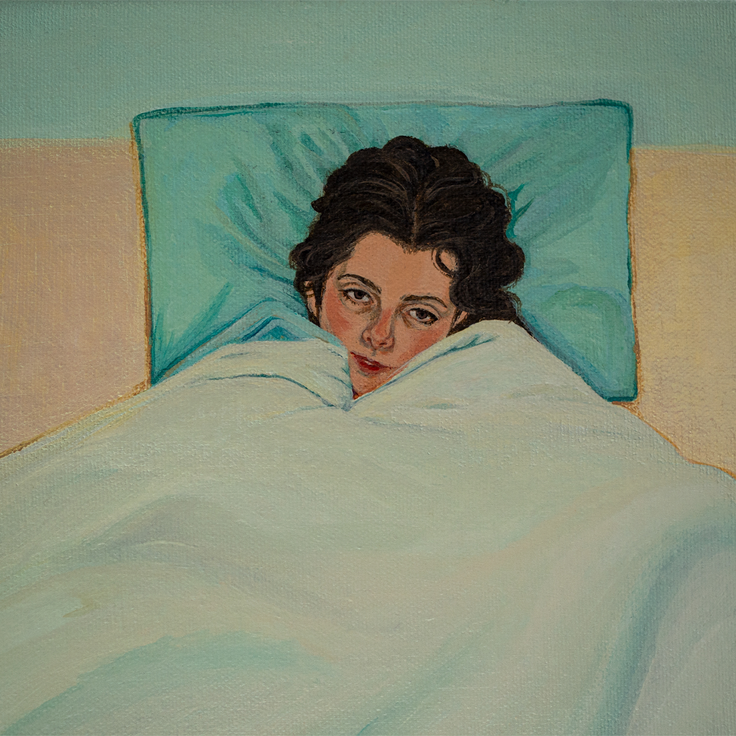 A girl lying in bed alone