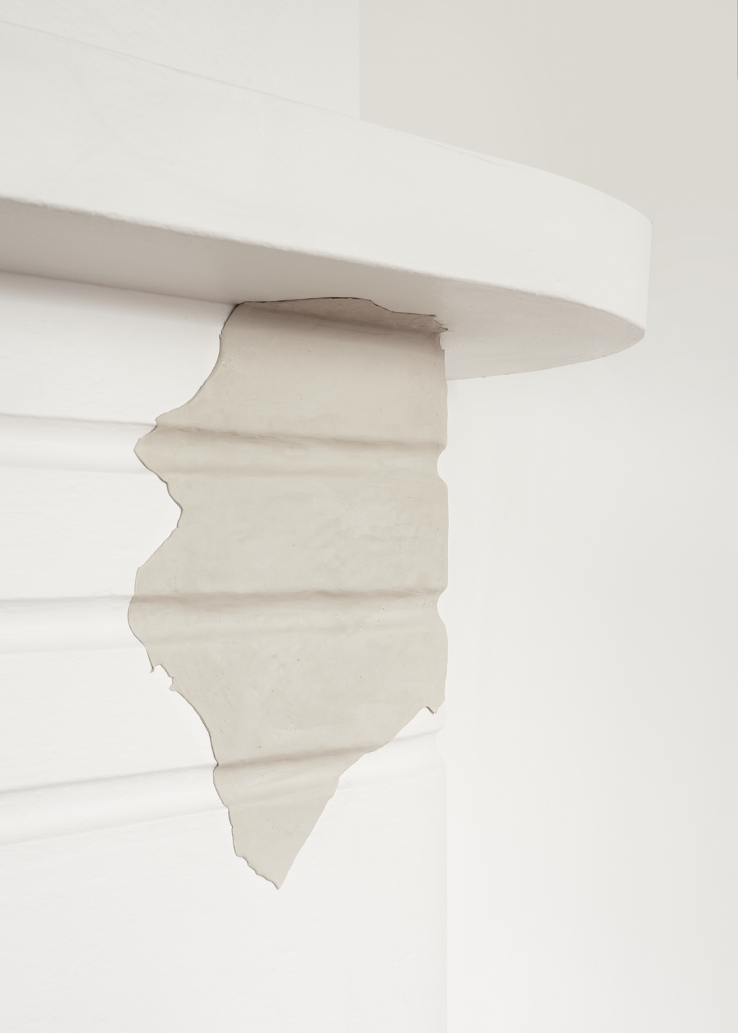 Clay pressed into ceiling cornice