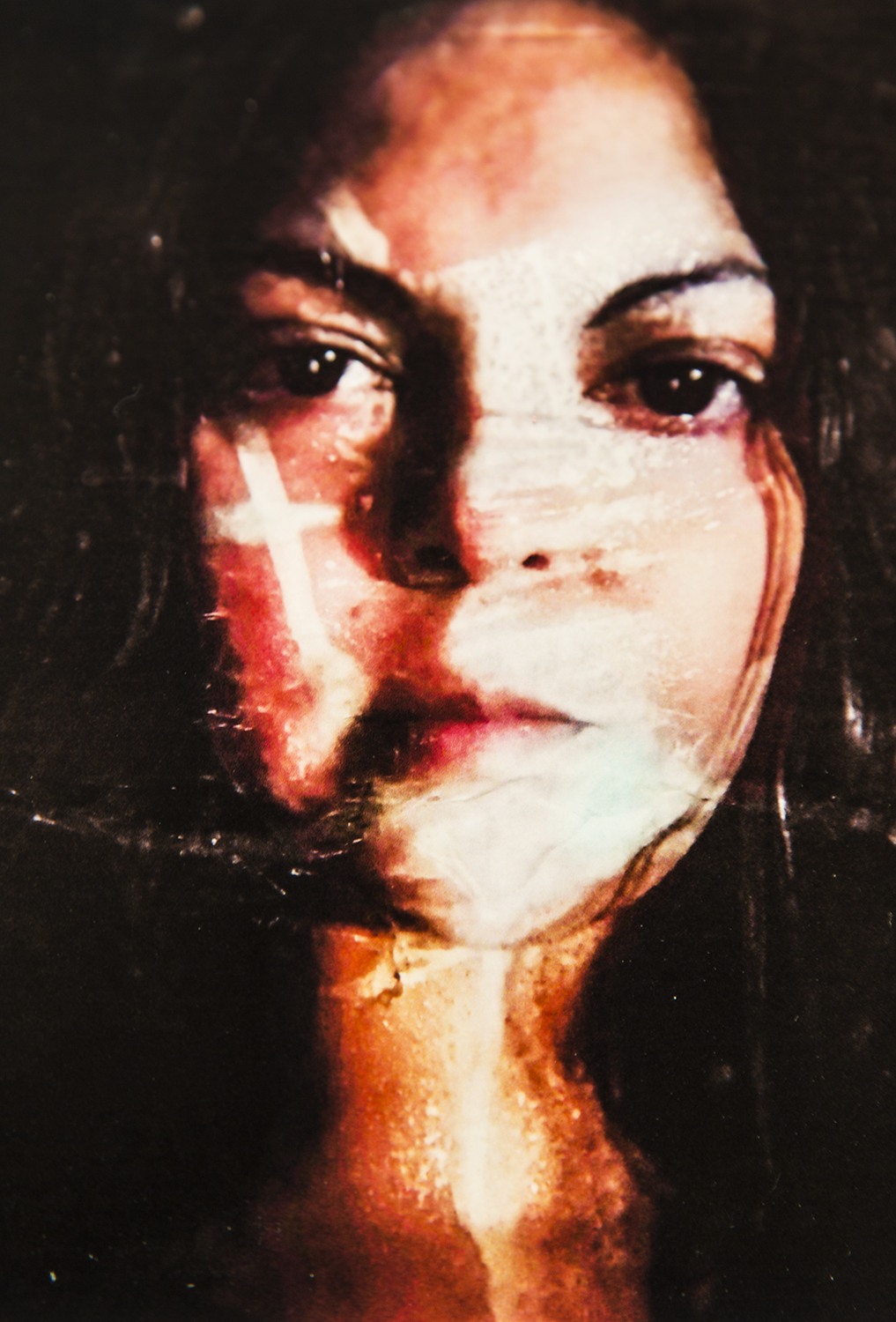 Photographic self portrait where it has been manipulated manually and re photographed.