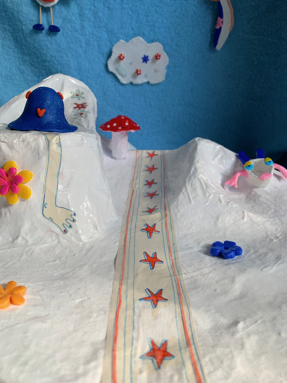 A collection of paper mache forms, cartoonistic characters.