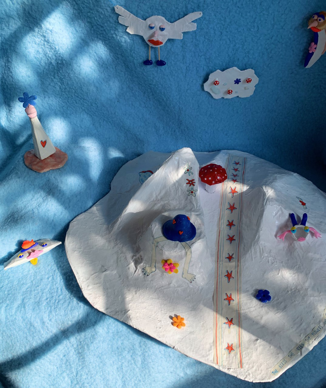 A collection of paper mache forms, cartoonistic characters.